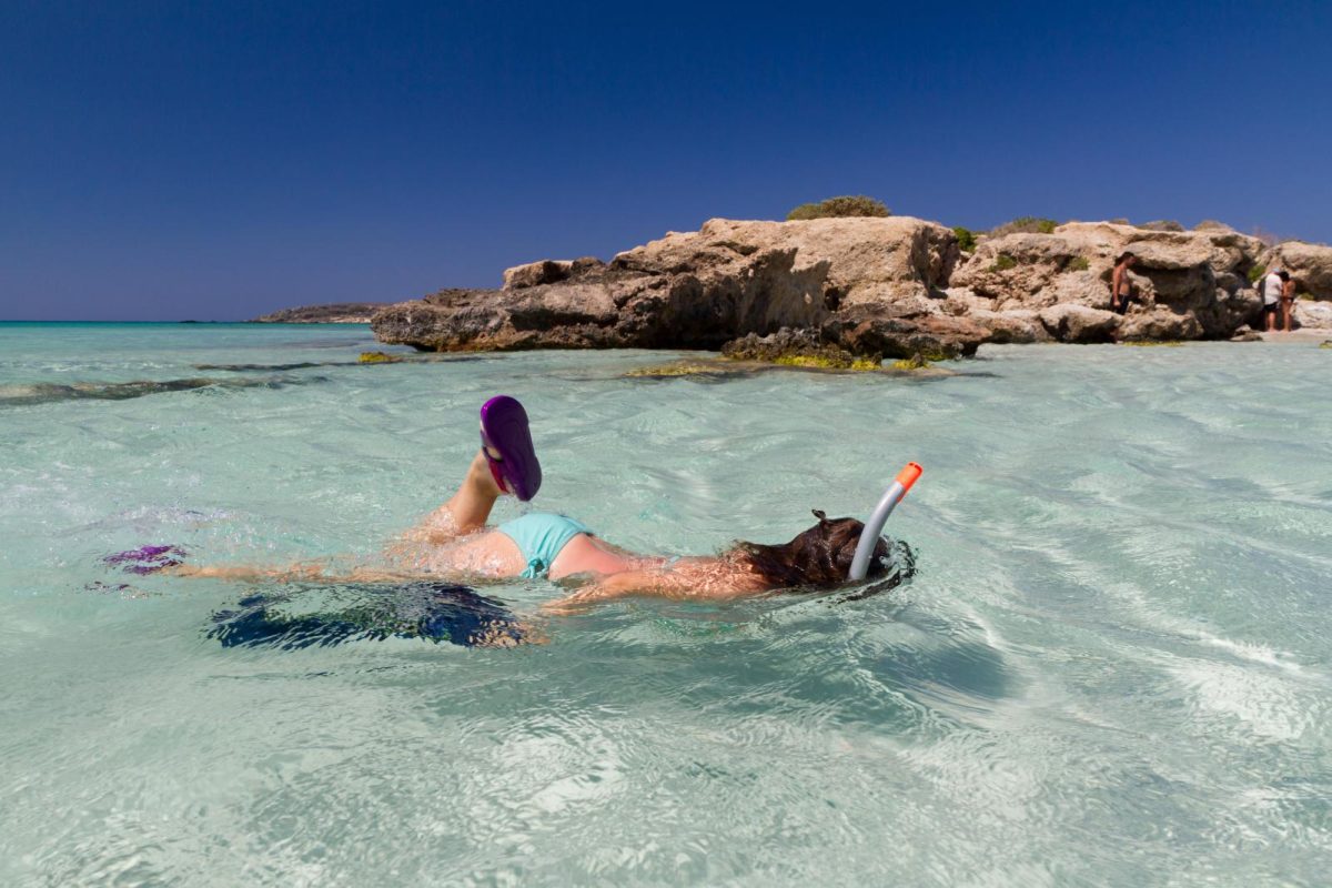 kids snorkeling in the shallow waters in Elafonissi beach