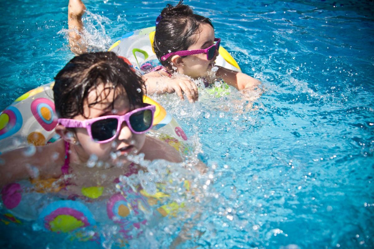 kids swim in hotels pool