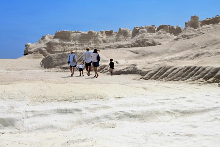 A family enjoying the lunar Landscape on Milos Island