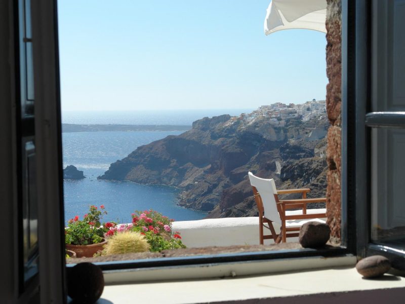 Santorini caldera view through room window KidsLoveGreece