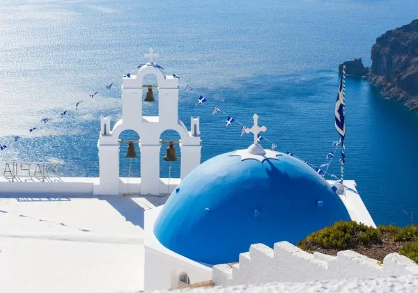 Kids Love Greece Santorini Tour The Three bells of Fira and blue dome, Santorini, Greece, Europe.