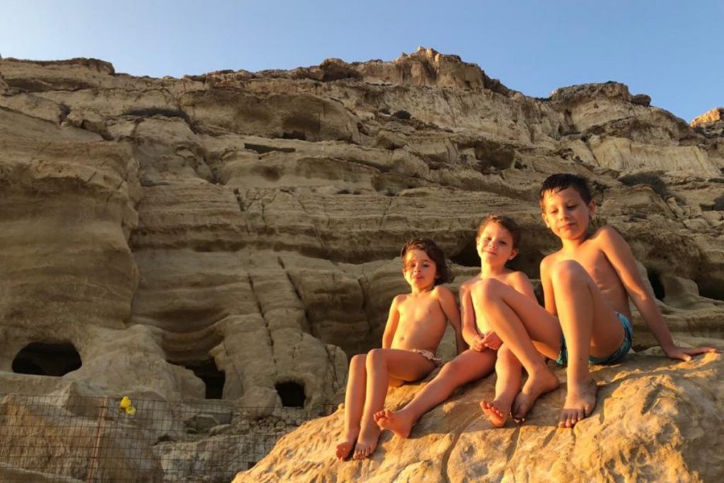 Happy kids posing in front of Matala Caves in Crete MT (2)