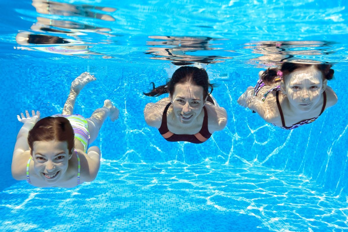 girls swimming in pool athens greece-min