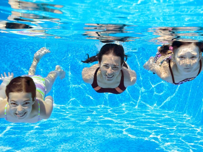 girls swimming in pool athens greece-min