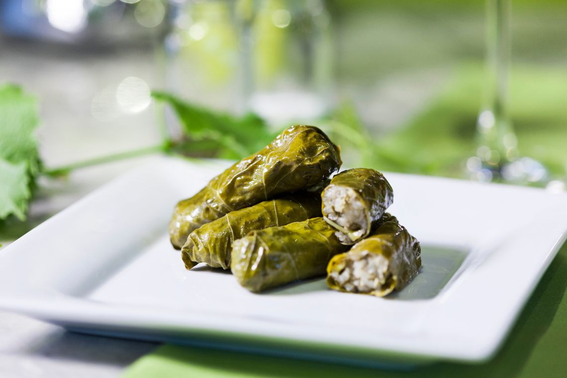 Dolmades With Vine Leaves and Egg Lemon Sauce featured canva