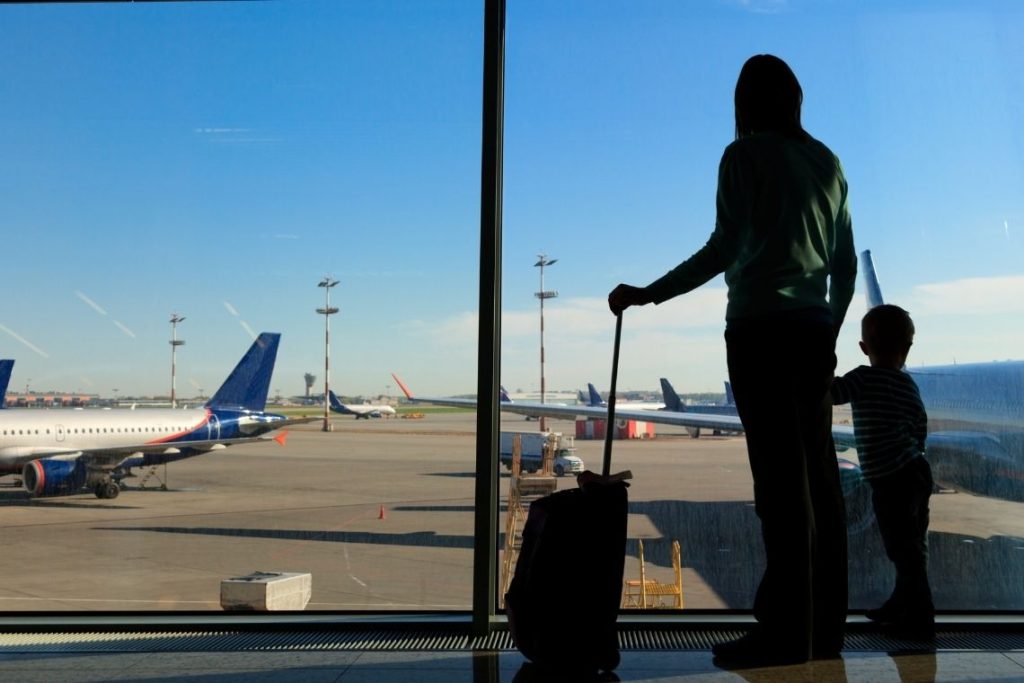 family in the airport_canva